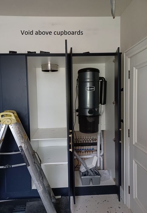 Laundry chutes and a central vacuum system