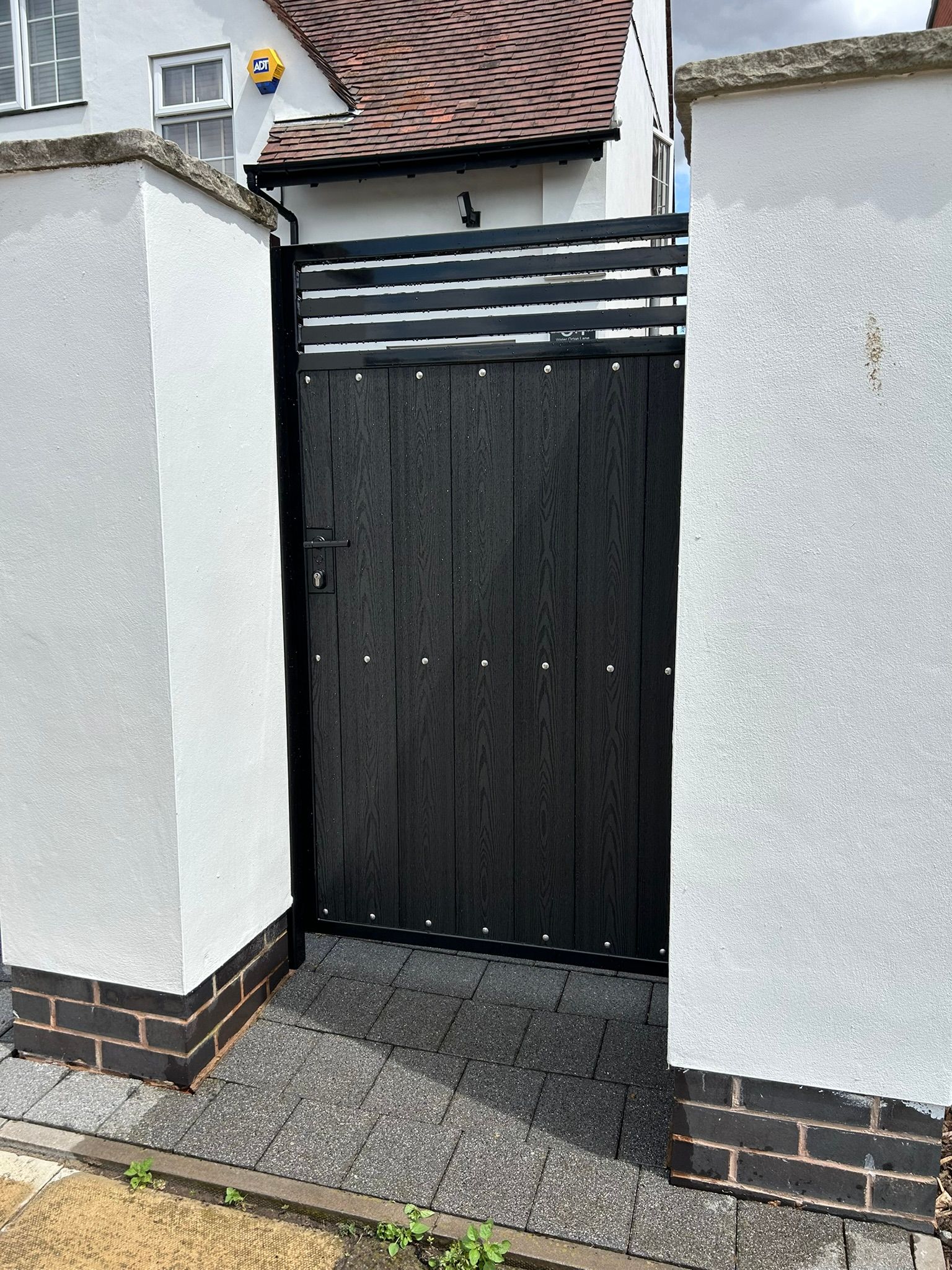 Hybrid black ash composite sliding gate
