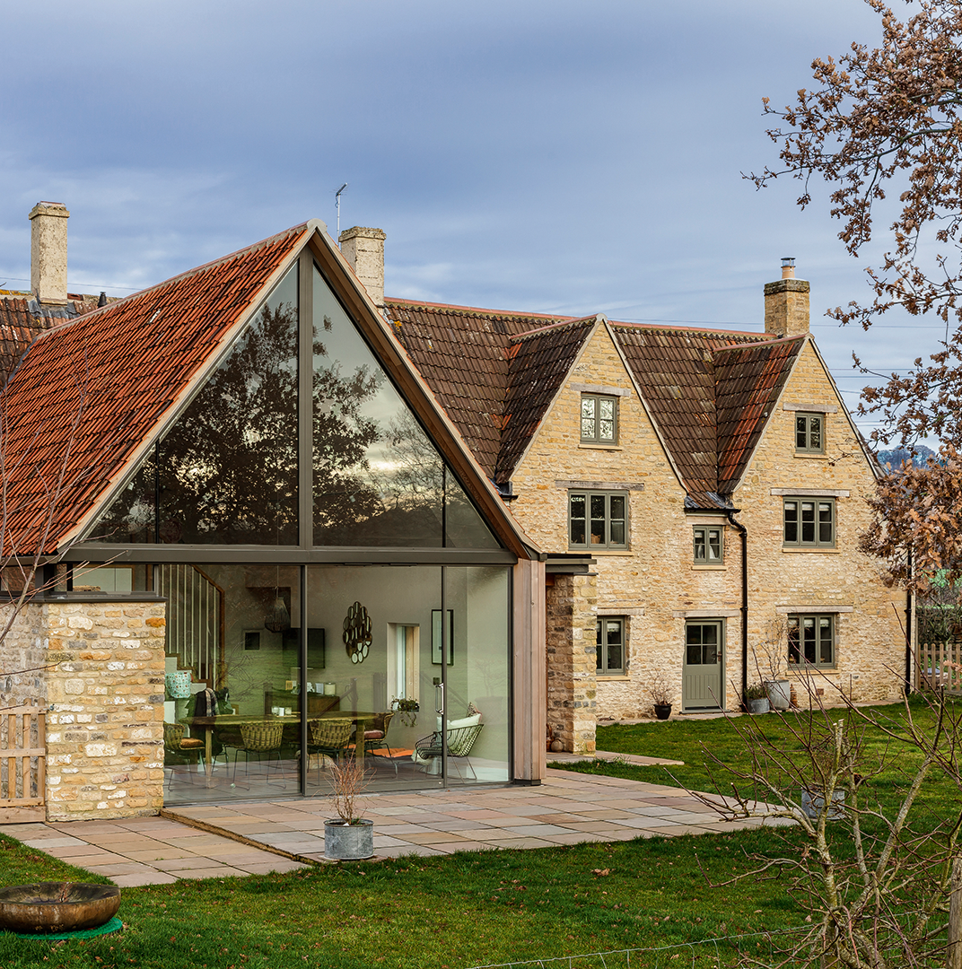Stone house with an extension in the countryside