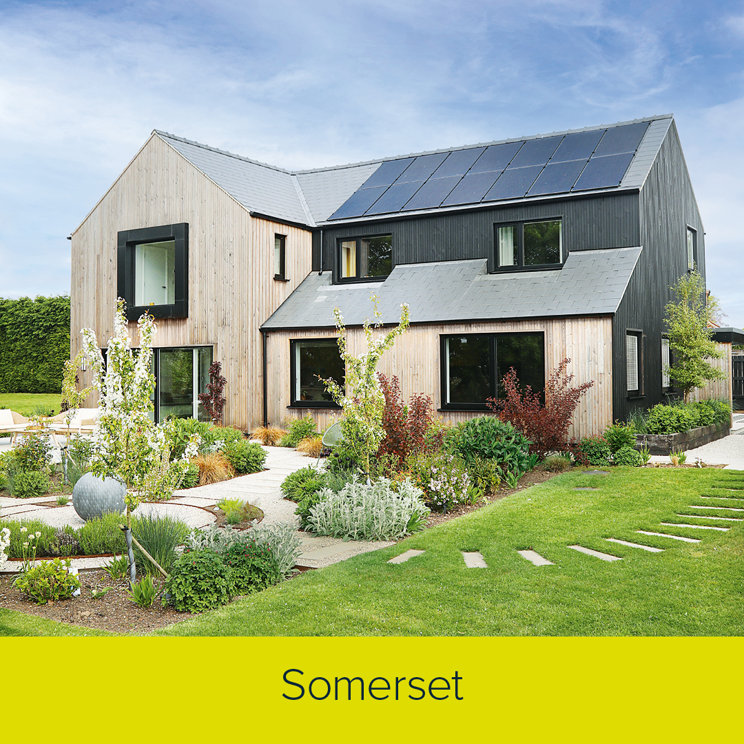 Self-Build House with solar panels on the roof and built with timber