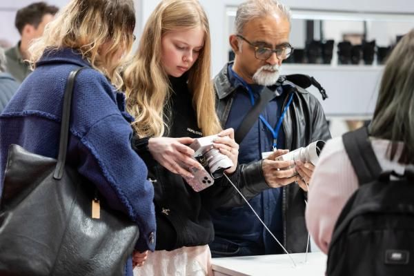 Visitors getting hands-on with cameras