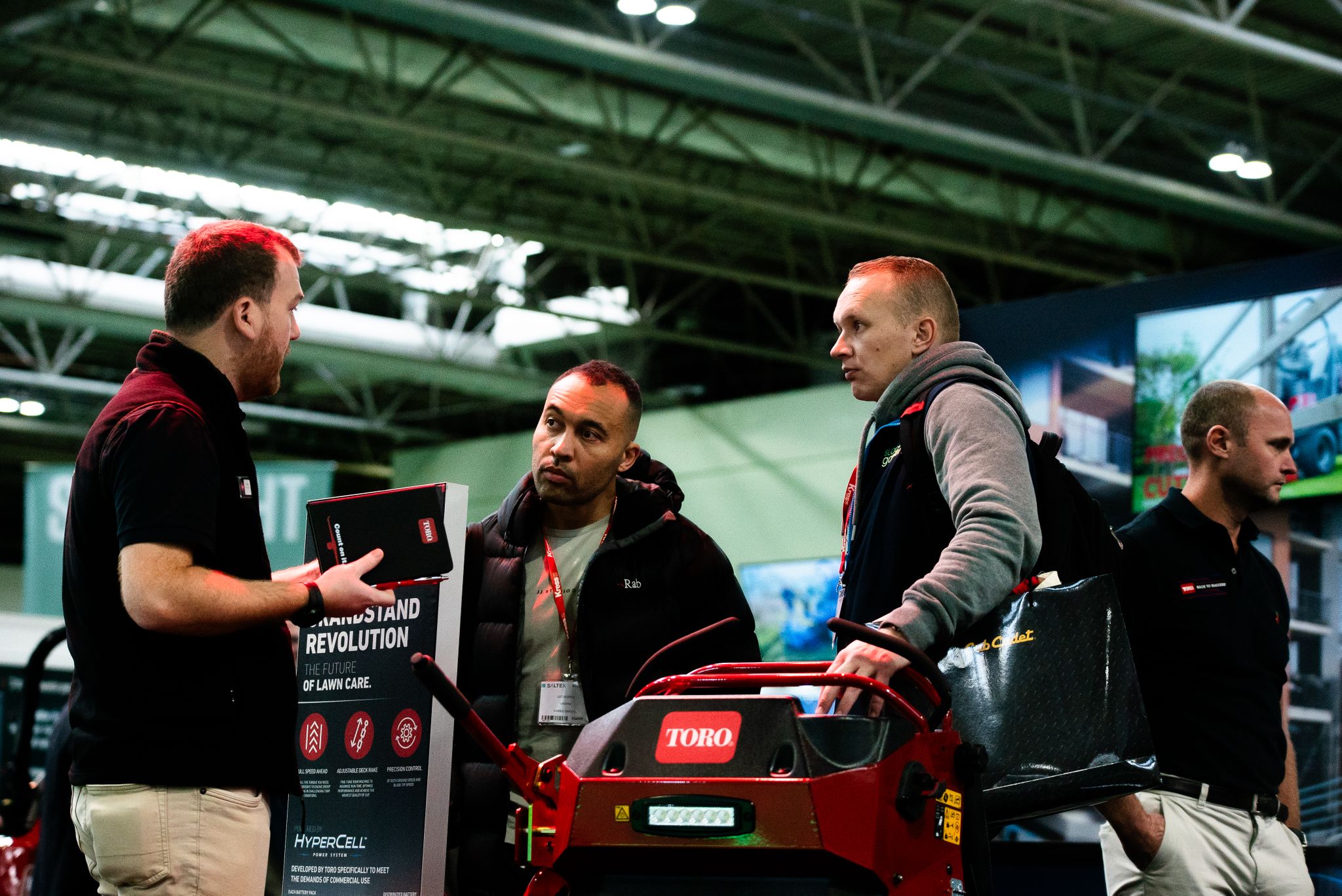 Exhibitor and attendee at stand discussing products