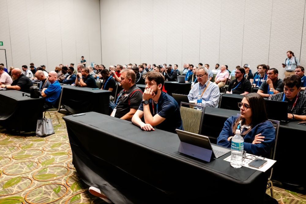 attendees taking a lecture session course