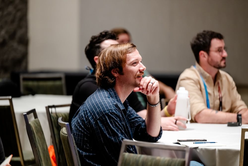 InfoComm student smiles during an AVIXA Training Course