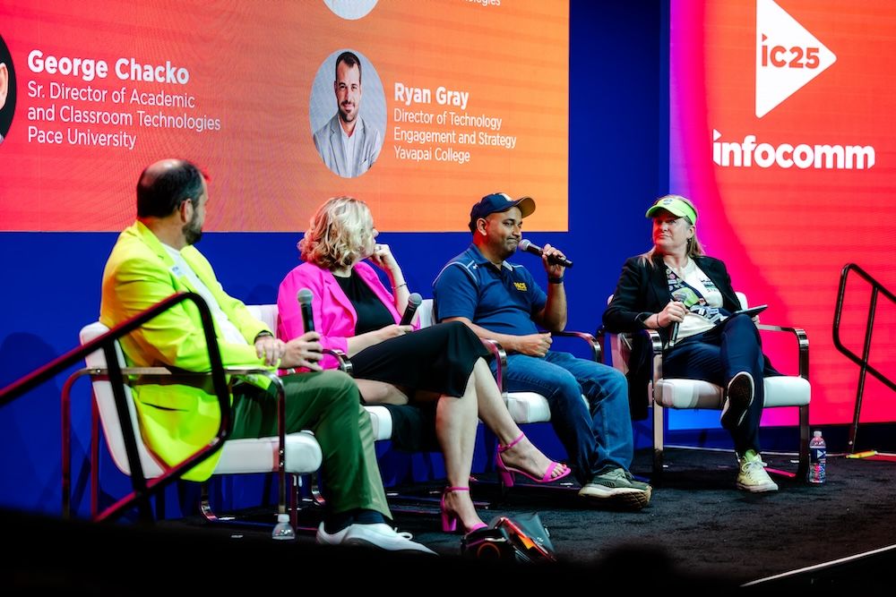 A panel on the InfoComm Technology Innovation stage talk with one another