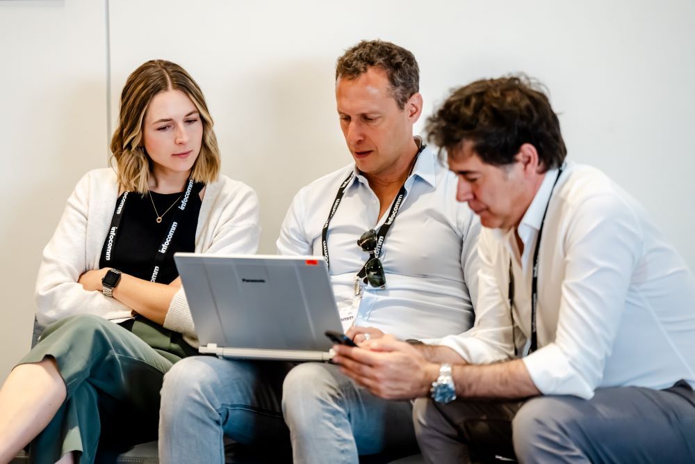 A group of attendees connect to the InfoComm wifi