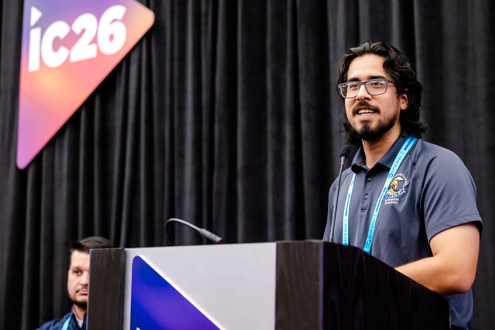 InfoComm speaker at a podium