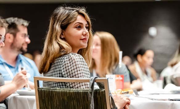 InfoComm student listens in a workshop