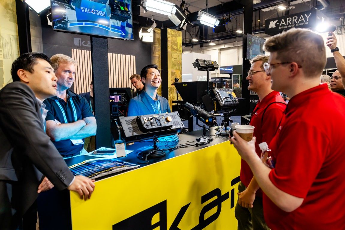 InfoComm show an attendee the pro AV technology in their booth