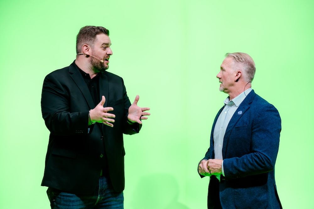 speakers in front of green screen