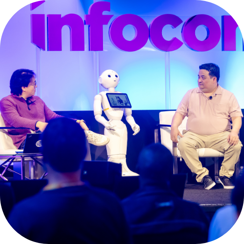 AI robots speak on an InfoComm stage