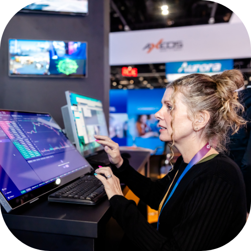 An InfoComm attendee uses AVoIP technology on the show floor.