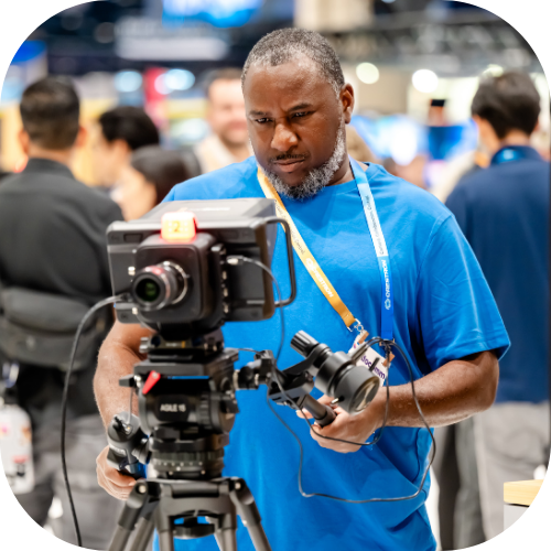 InfoComm attendee uses broadcast AV equipment in the exhibit hall