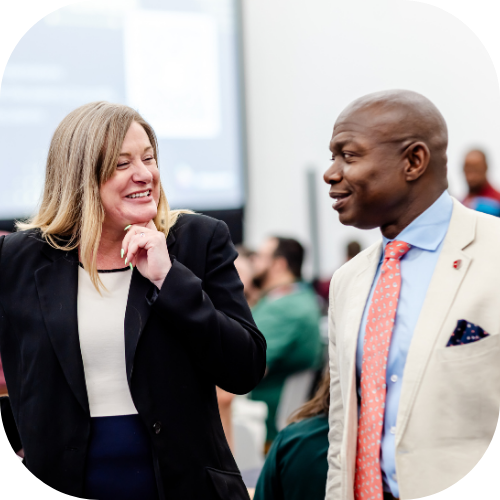 Two InfoComm attendees talk about business management after a session