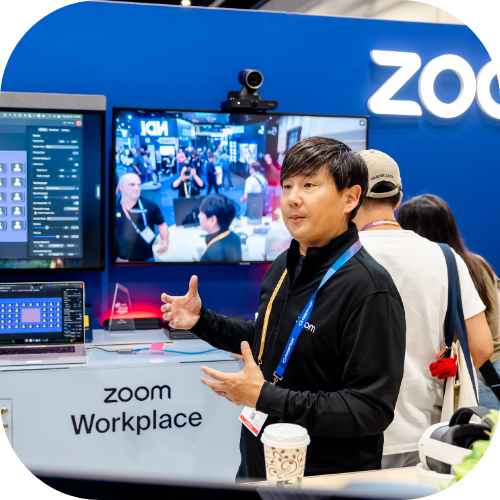 An InfoComm exhibitor shows their conferencing and collaboration technology in the exhibit hall