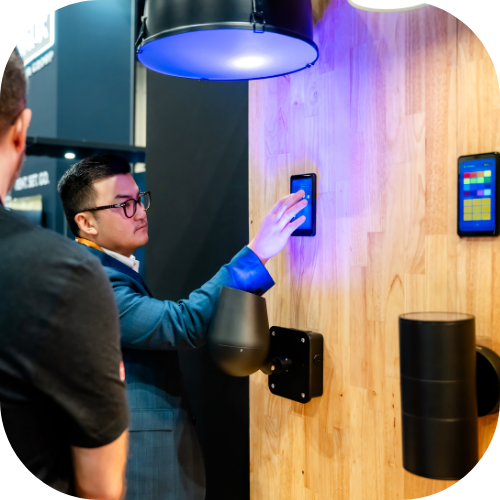 An InfoComm exhibitor shows off their integrated space on the show floor