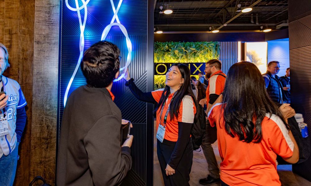 A Lightapalooza attendee explores new lighting technology in a booth