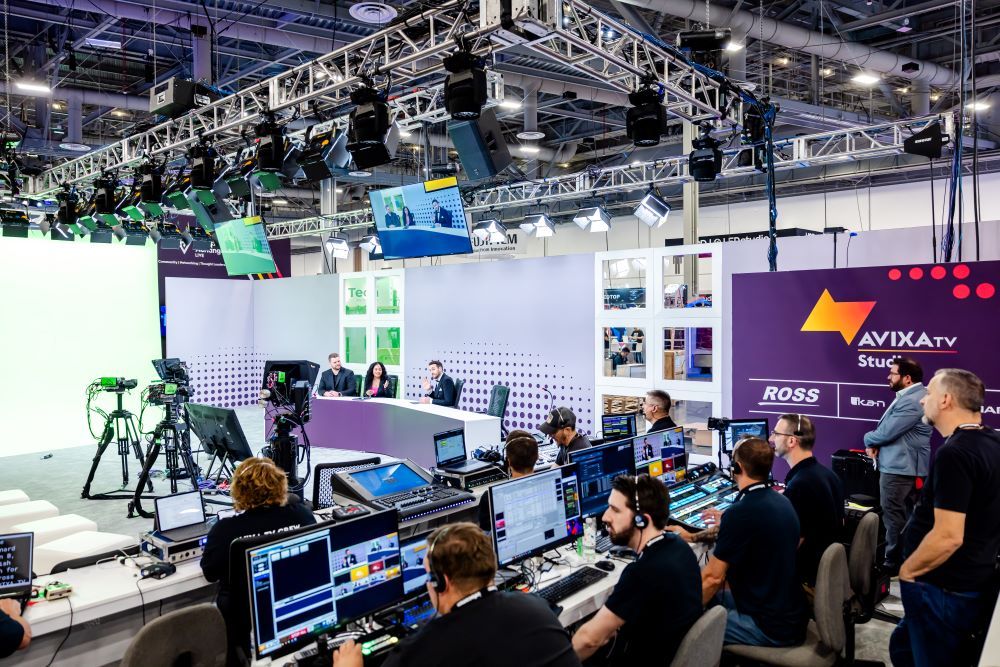 A behind the scene look at the AVIXA booth with cameras, sound, and lighting.