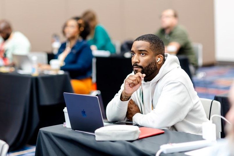 InfoComm student listens during an AVIXA Training Course