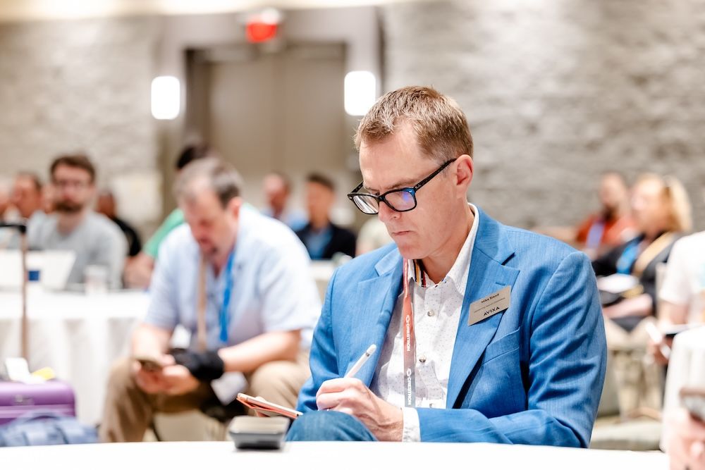 AVIXA member taking notes