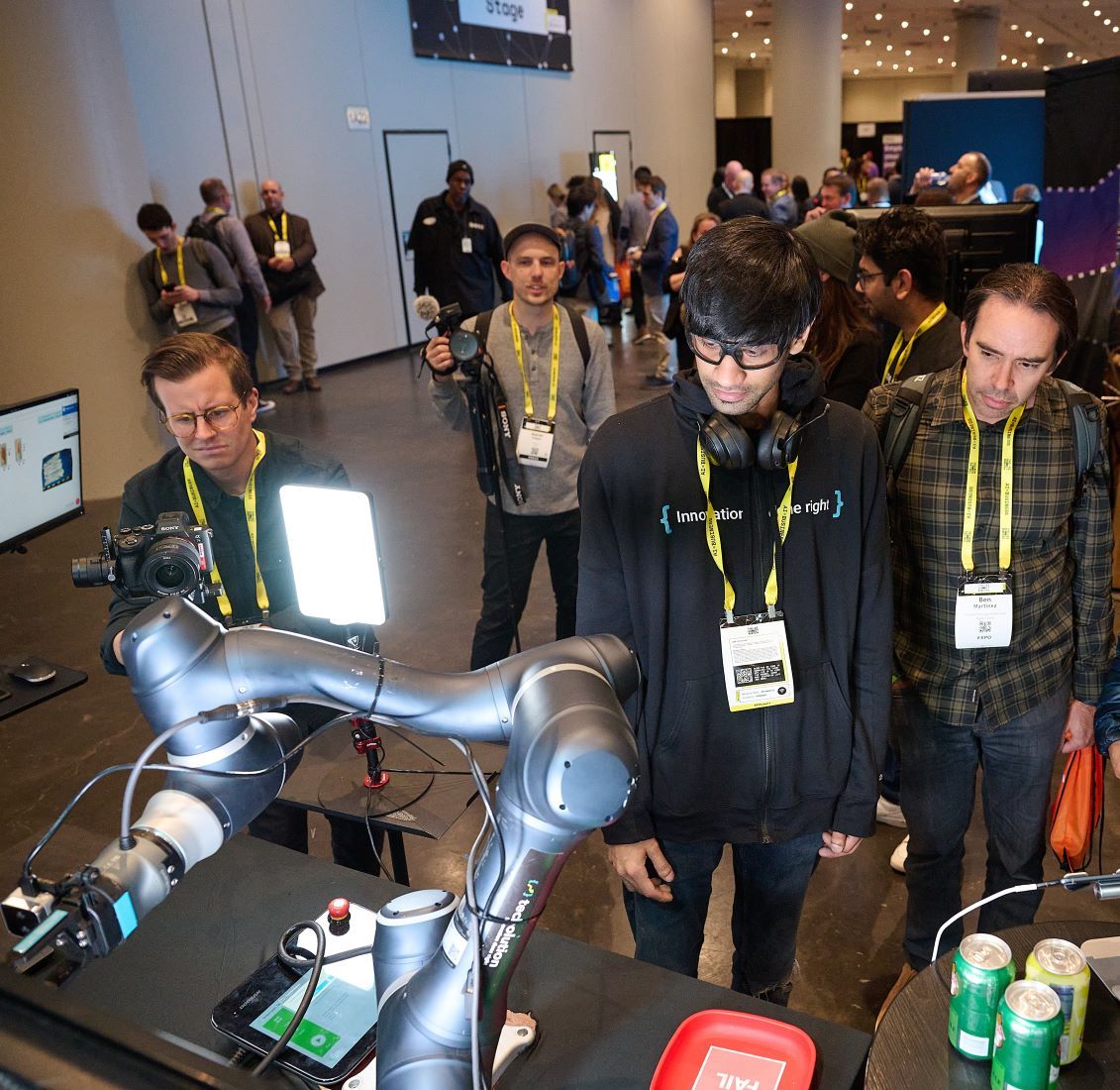 Delegates interact with AI robot arm at The AI Summit New York