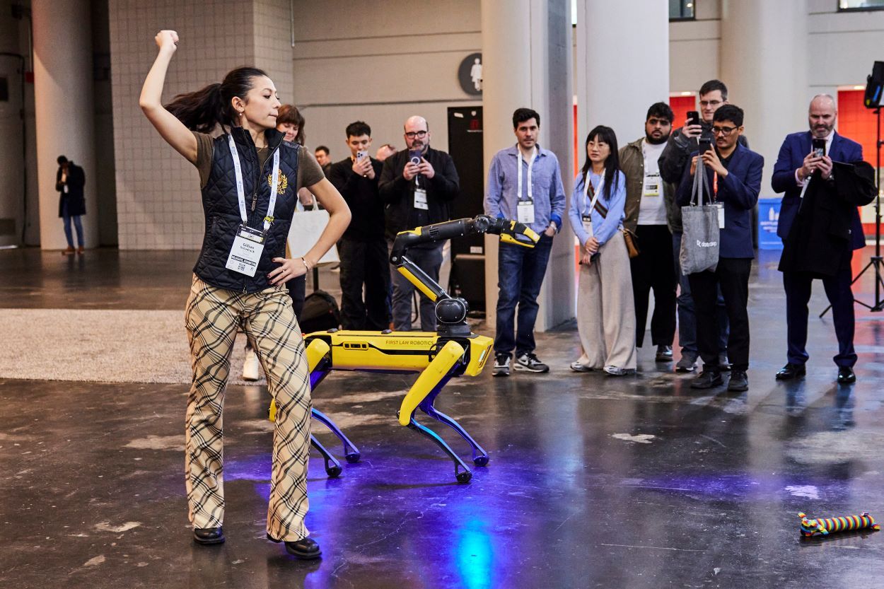 Robot and ballerina dancing at The AI Summit New York