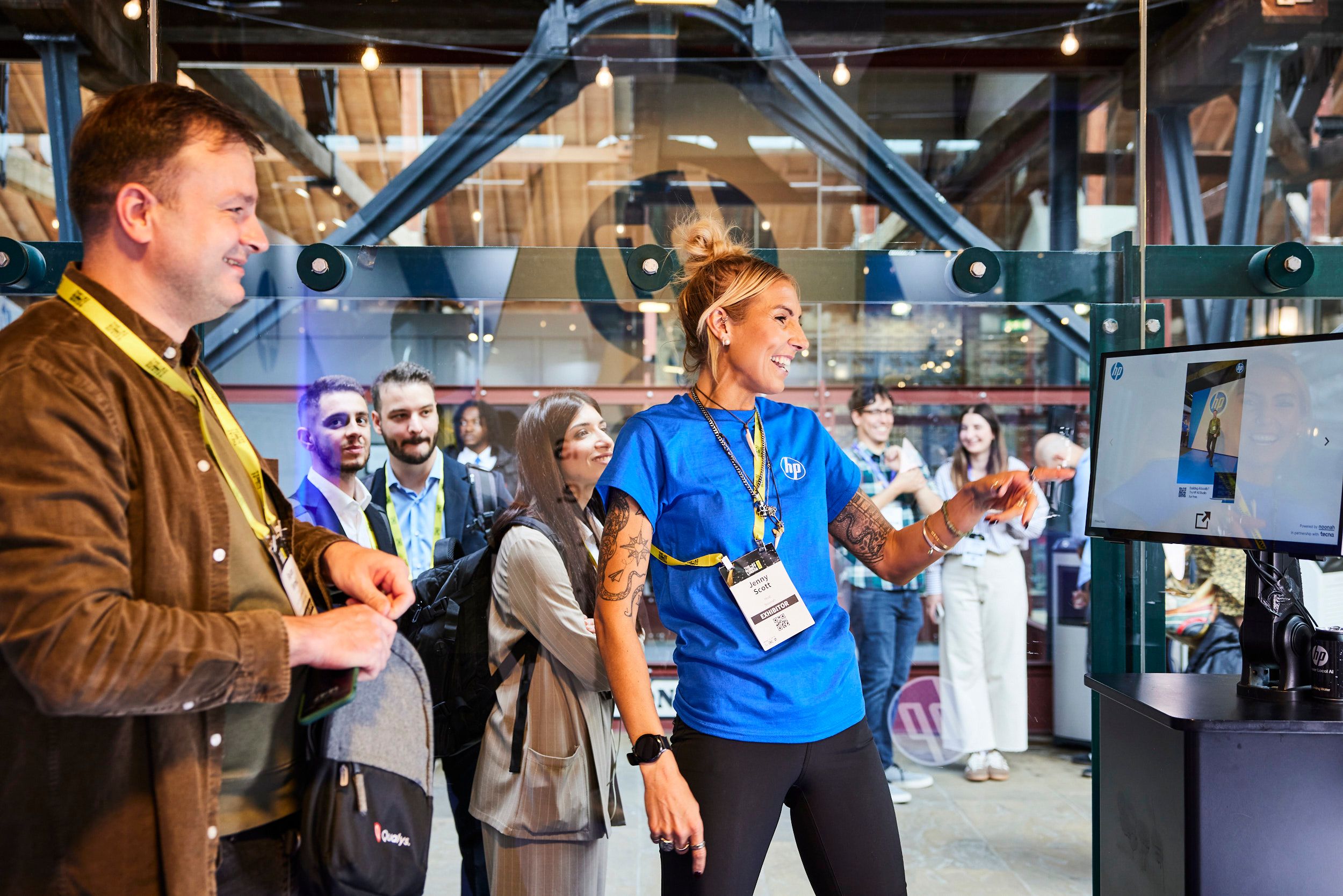 An attendee taking part in a product demo at the HP stand in The AI Summit London