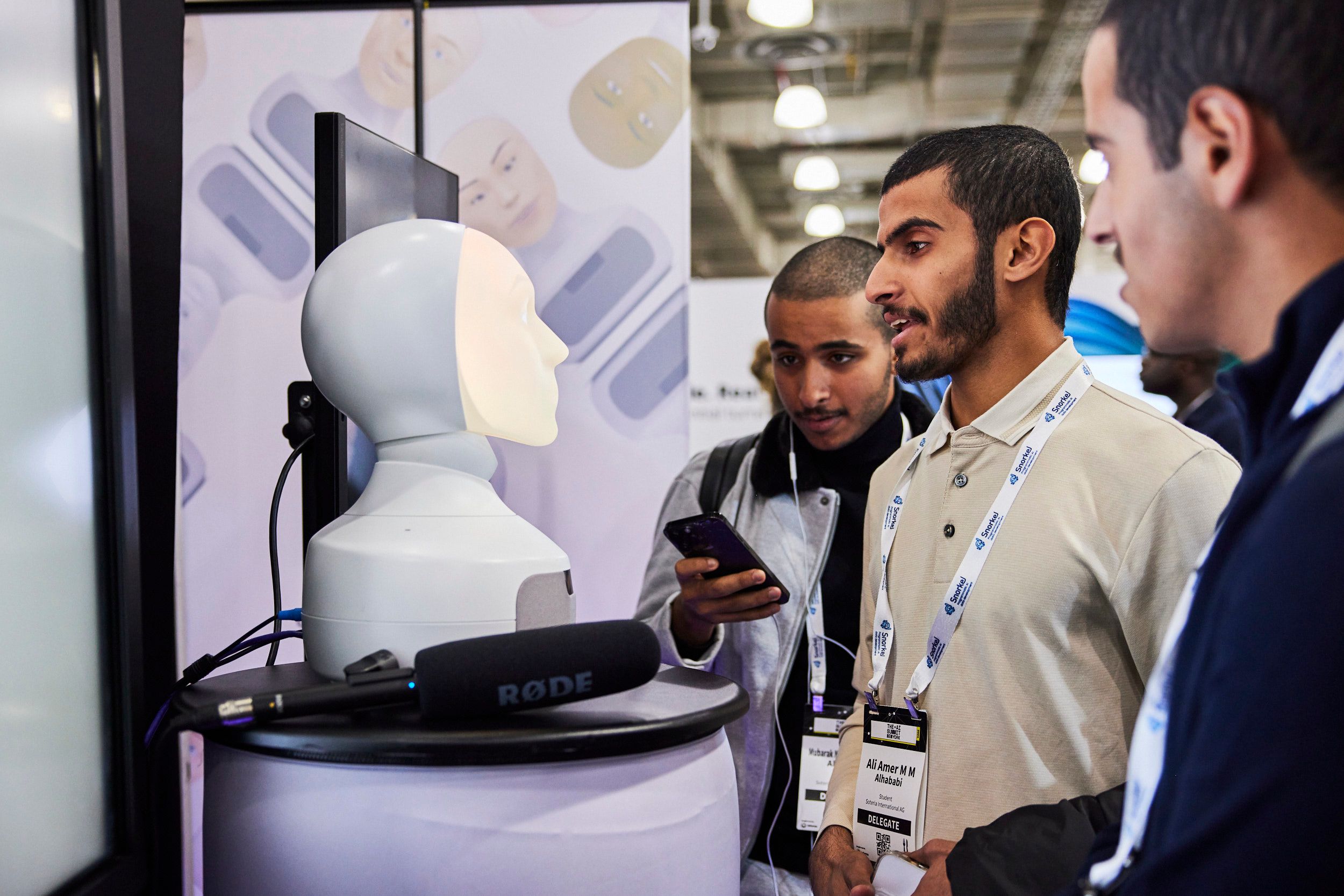 Attendees at a booth at The AI Summit New York