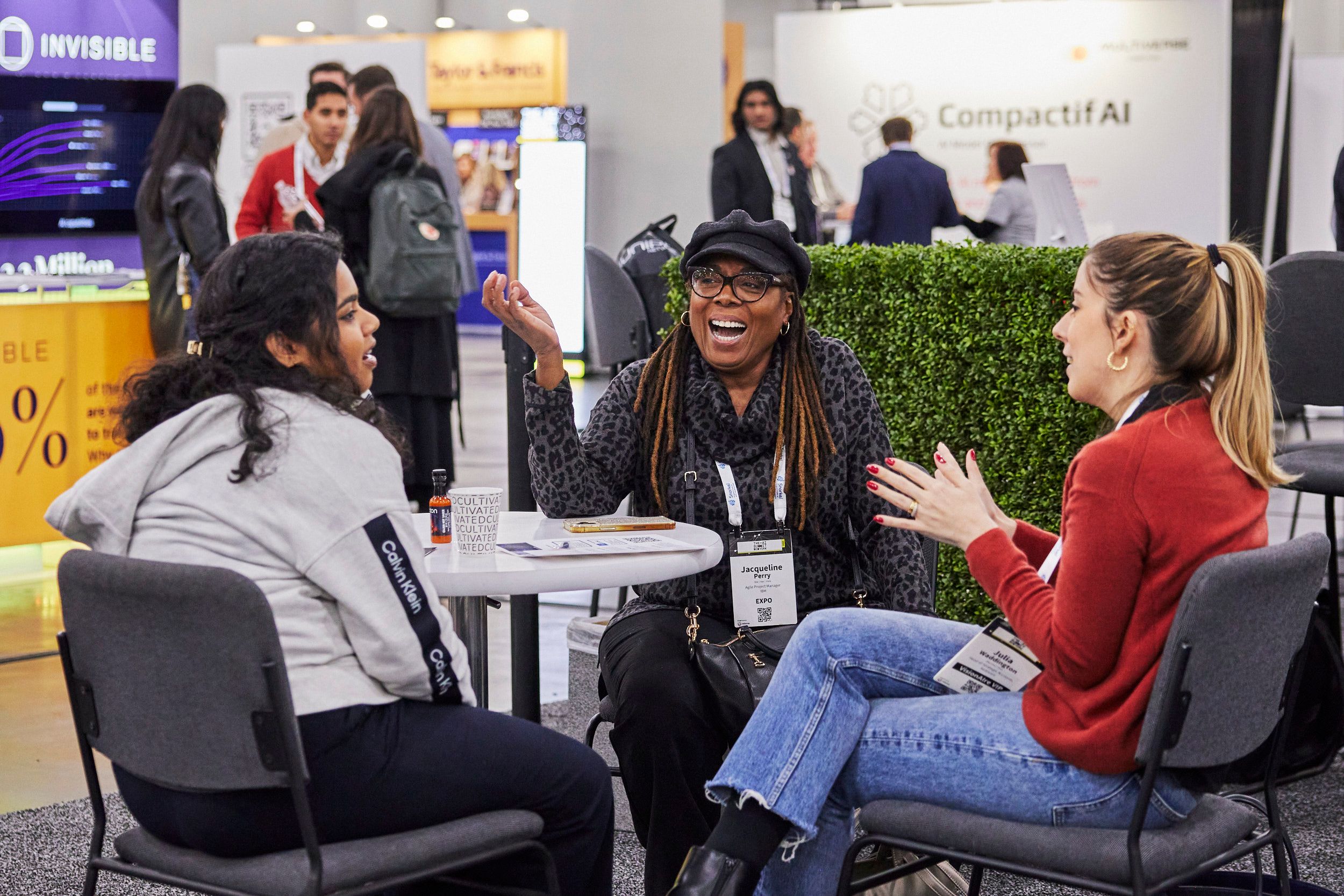 Three attendees at The AI Summit New York networking