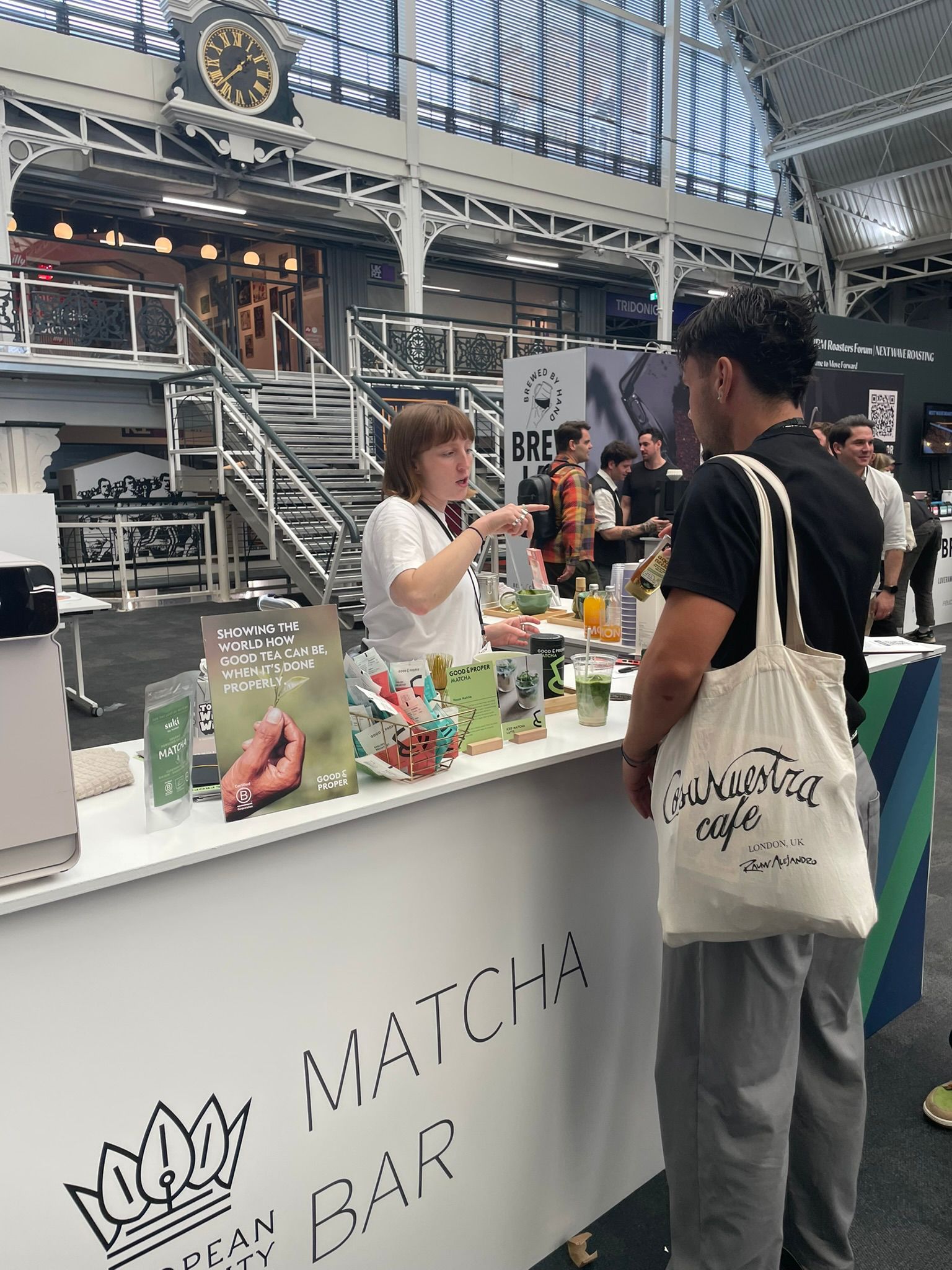 A visitor learning about matcha at the Matcha Bar