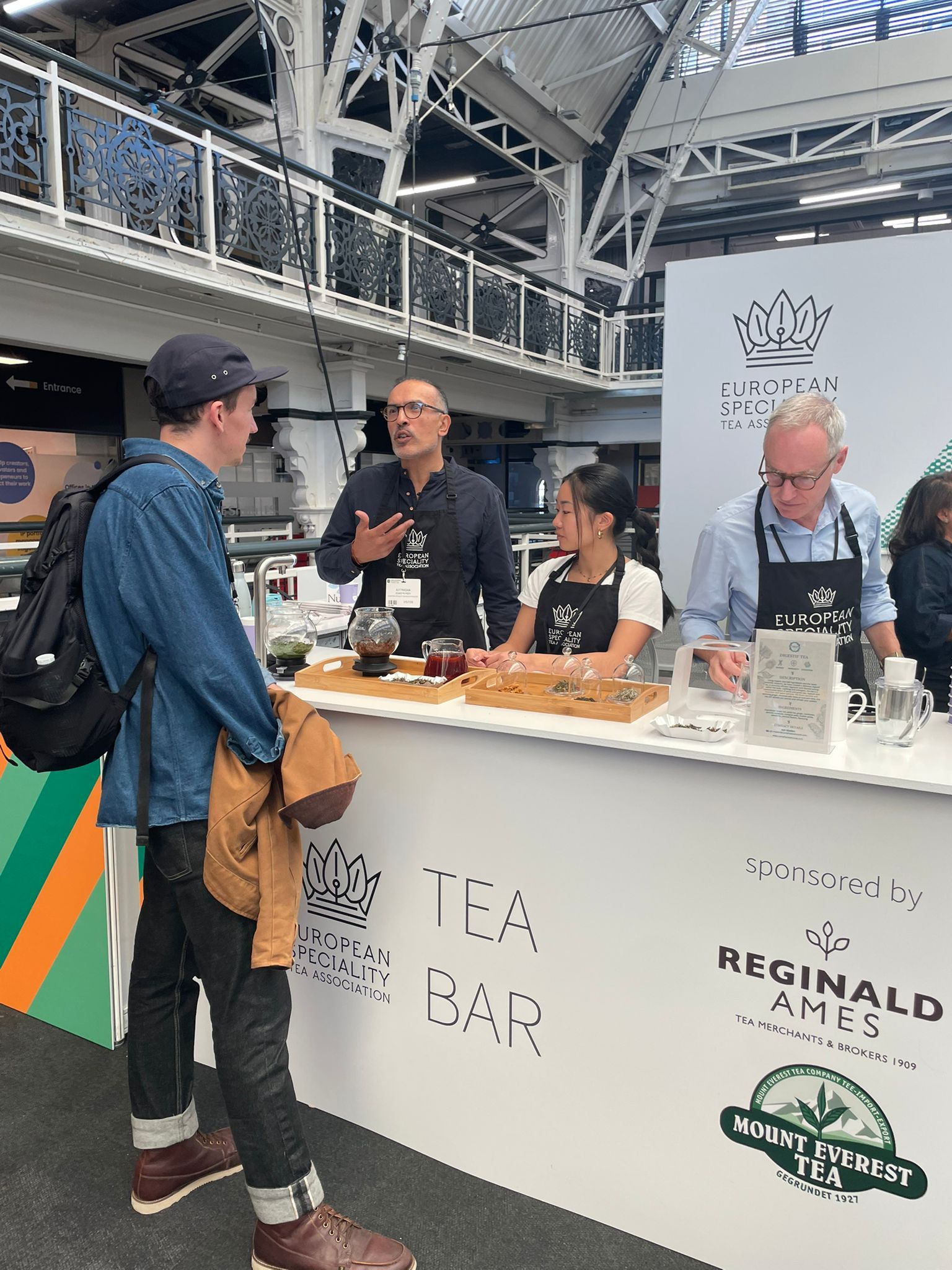 Visitors meeting tea specialists at the Tea Brew Bar