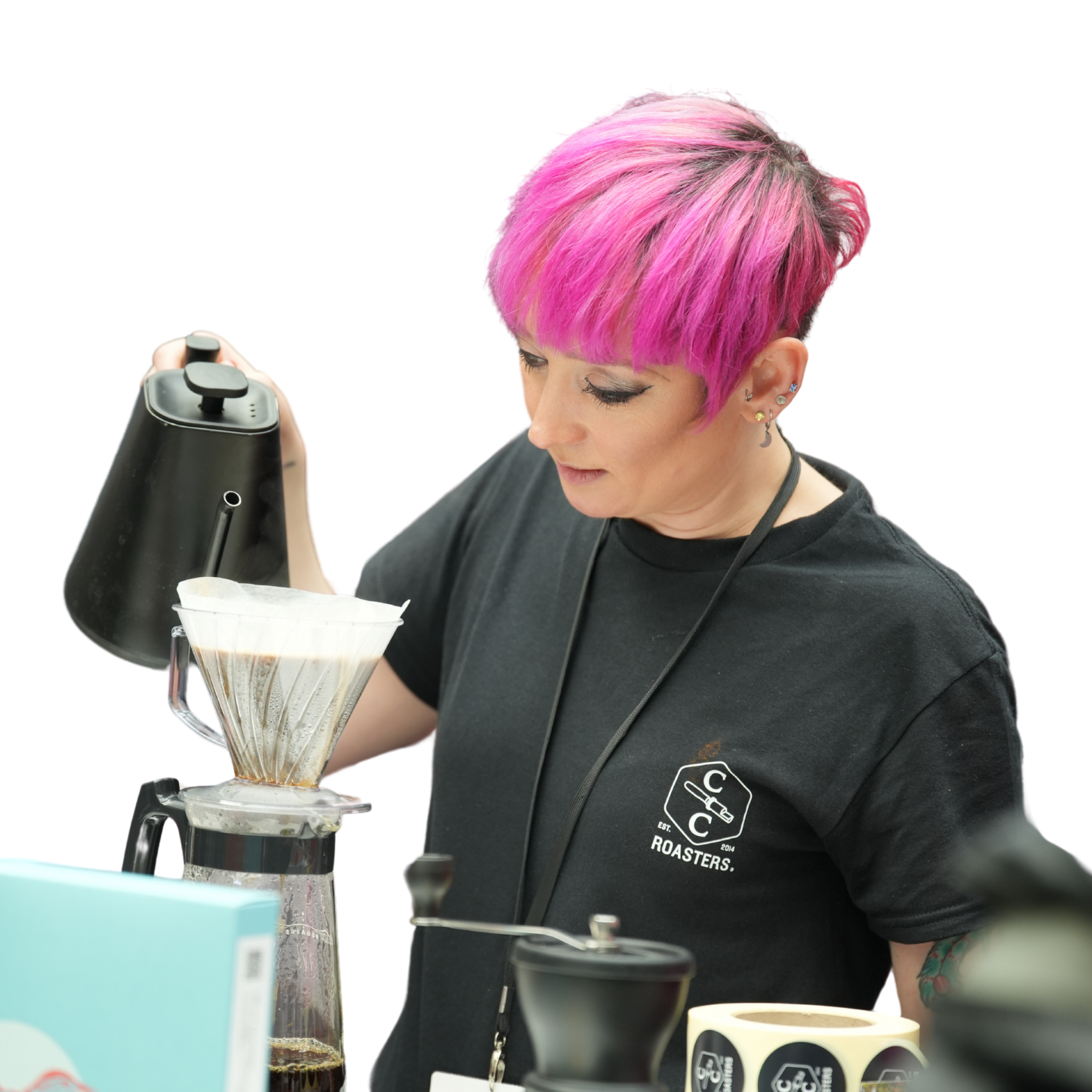 Barista pouring hot water into coffee