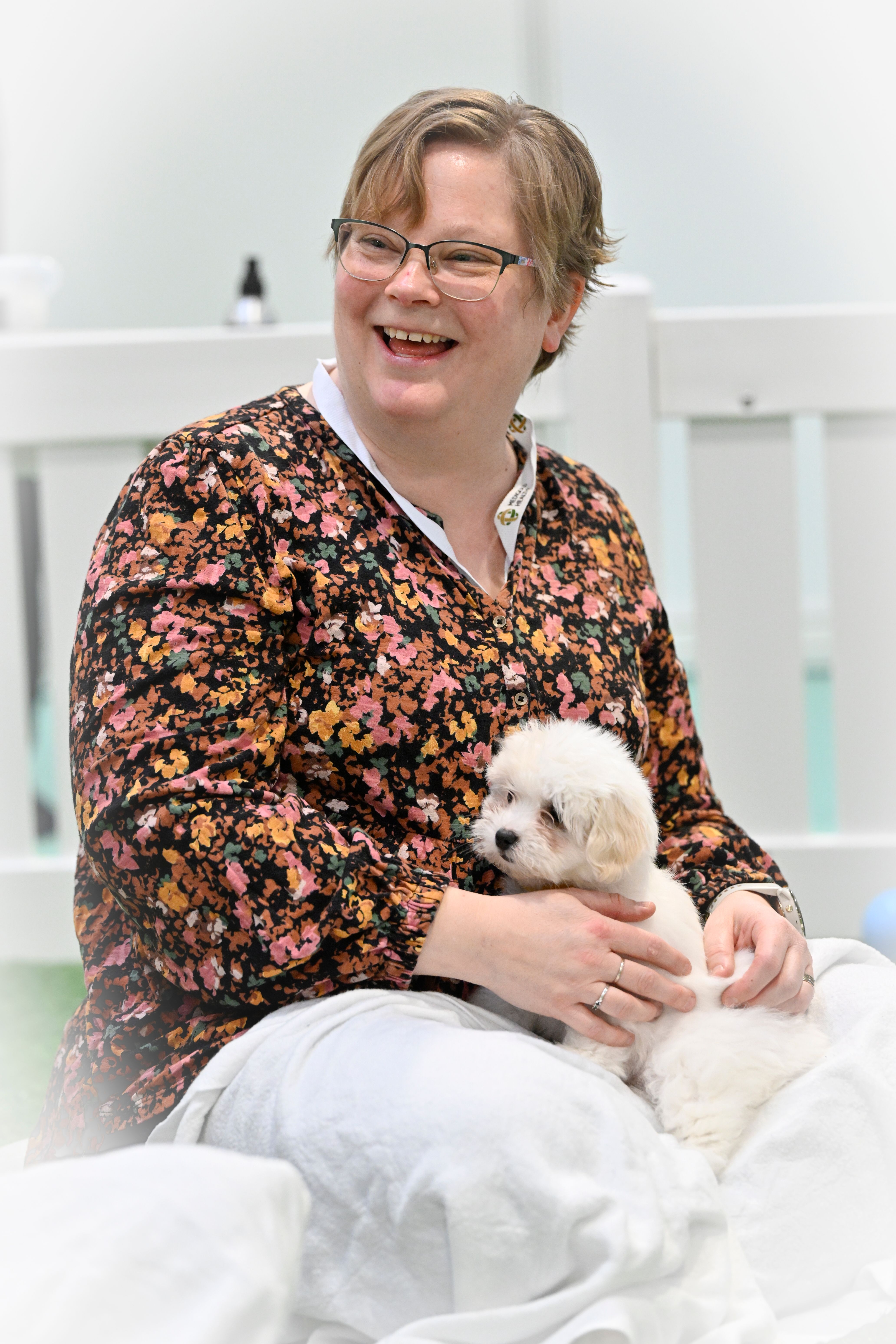 Woman holding a puppy