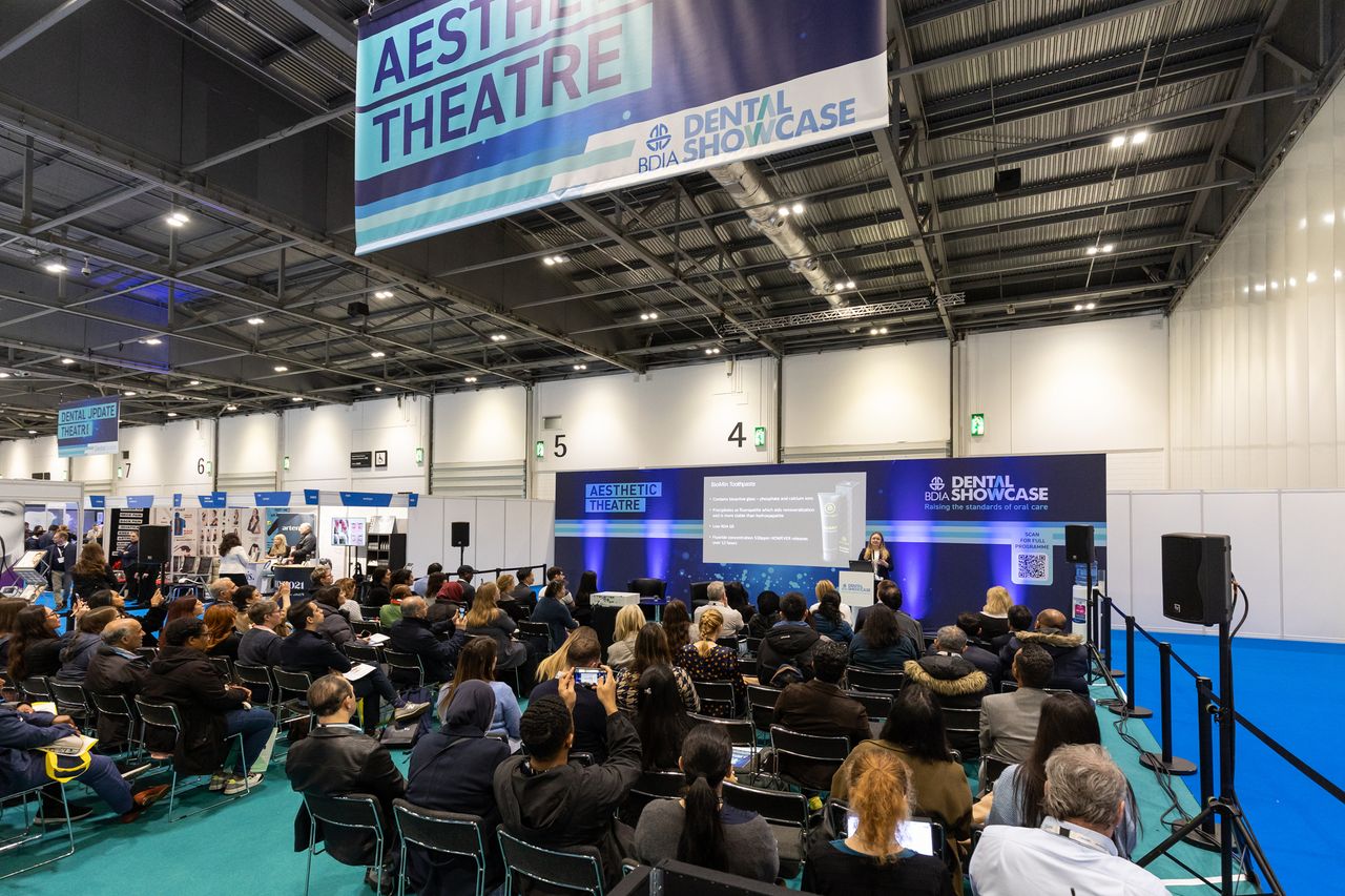 Dental professionals attend dental show on innovations in cosmetic dentistry and facial aesthetics.