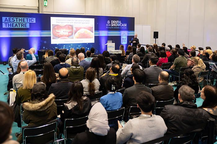 Dental professionals attend dental show on innovations in cosmetic dentistry and facial aesthetics.