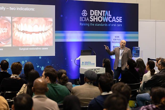 Dental professionals attend dental show on innovations in cosmetic dentistry and facial aesthetics.