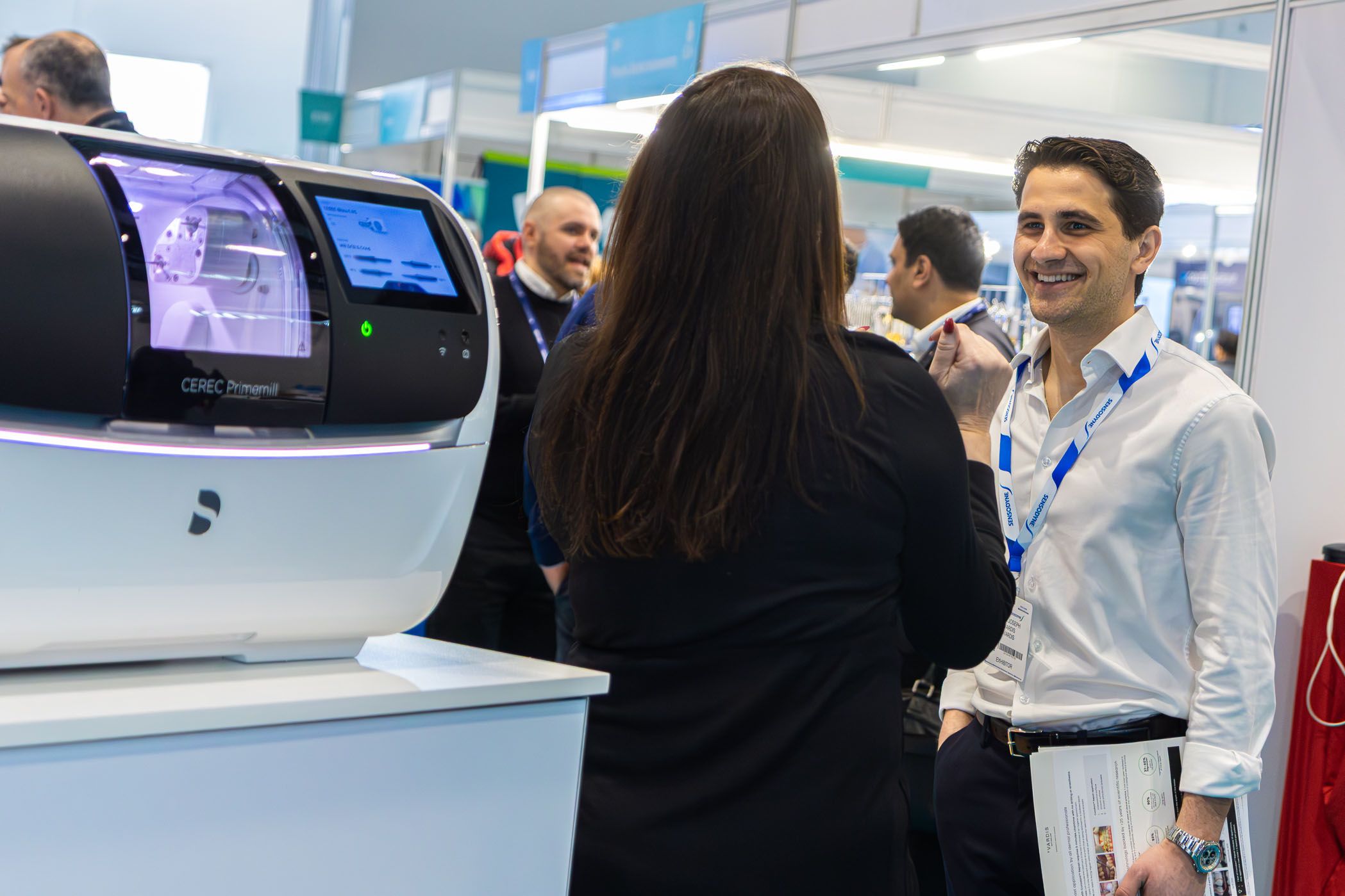 Exhibitor and visitor chatting and laughing