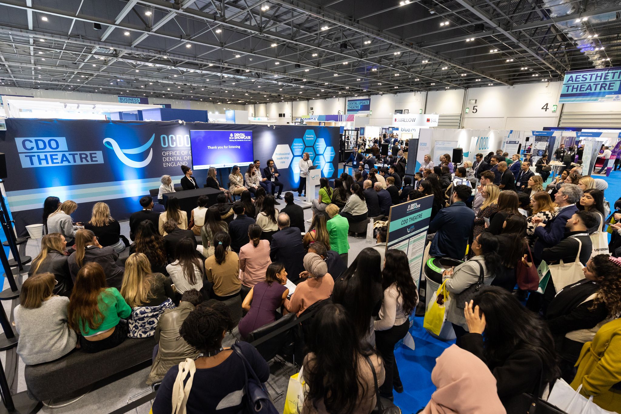 Group of dentists delivers a speech during a dentistry conference panel to an audience of dentists and odontologists at the BDIA Dental Showcase conference at the CDO Theatre.