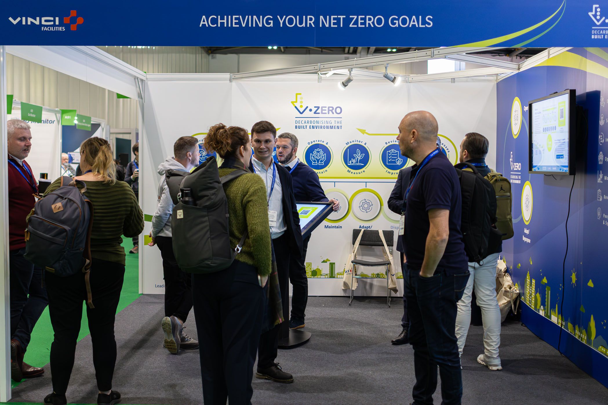 customers talking to exhibitors