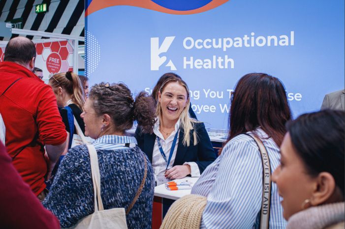 Exhibitor talking to visitors