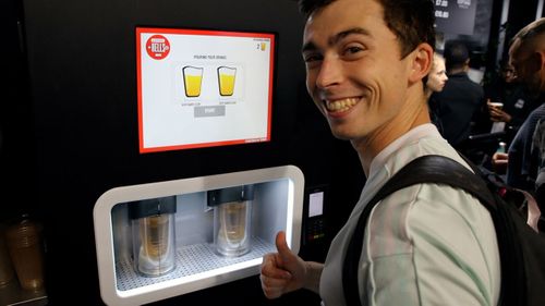 EBar in action. The world’s fastest automated beer dispenser pours perfect pints in a busy match day