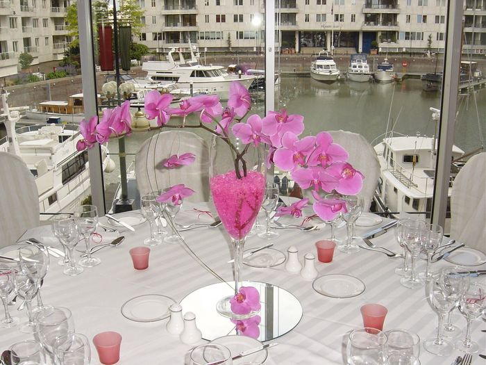 Tall Champagne Glasses filled with cascading orchids