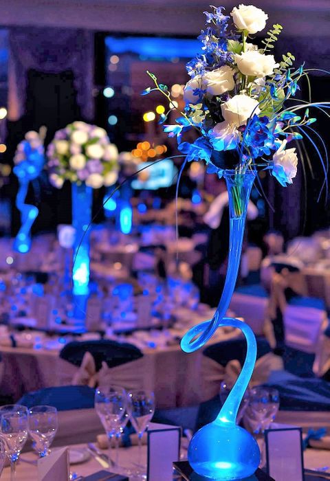 Tall Champagne Glasses filled with cascading orchids