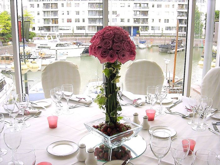 Tall Champagne Glasses filled with cascading orchids