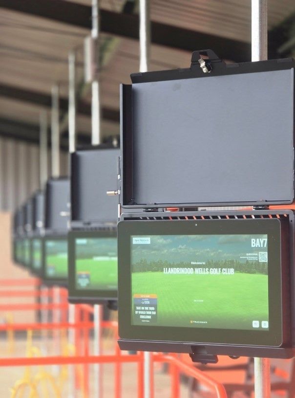 The screens at the driving range