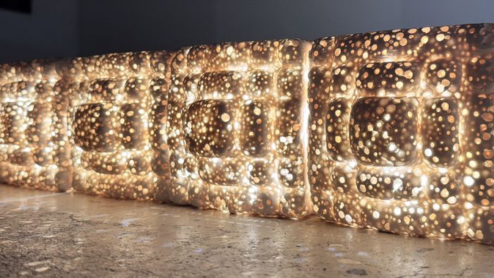 modular light system designed to integrate seamlessly into interiors through tile-like or brick forms