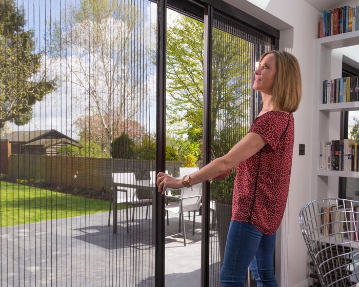 Manual fly screens for doors (pleated)