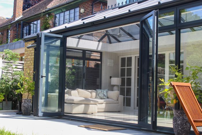 Manual fly screens for doors (pleated)
