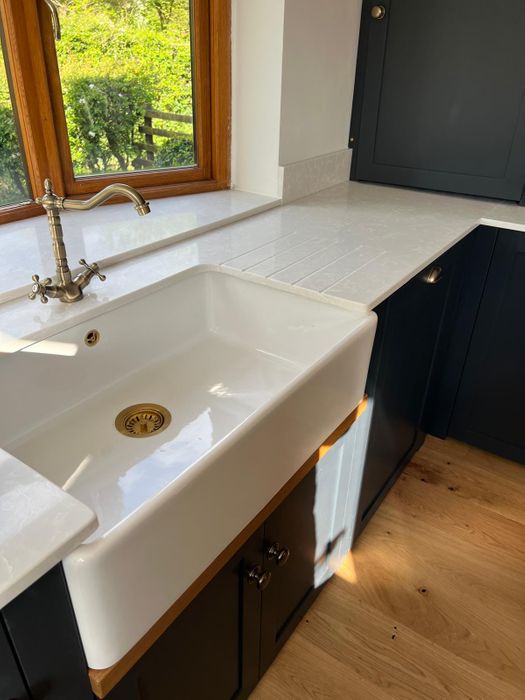 Solid wood kitchens with quartz worktops.