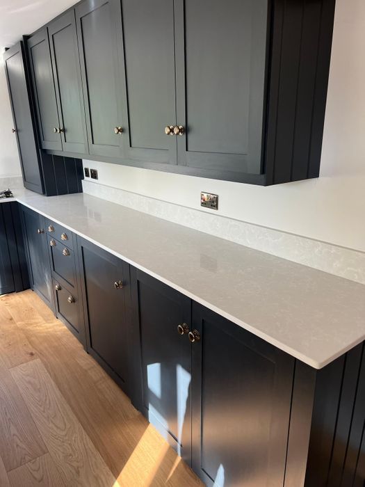 Solid wood kitchens with quartz worktops.